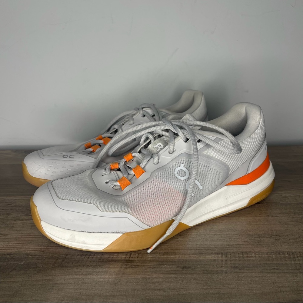 On Cloud Athletic Sneakers in Light Gray with Orange‎ Accents